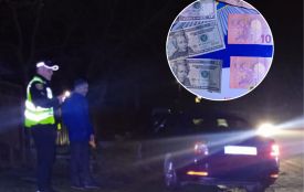 Поклав у кишеню поліцейського 80 євро та 45 доларів: жителю Львівщини загрожує кримінал